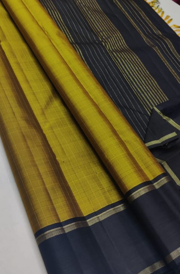 black and yellow kanchipuram saree