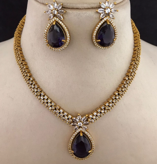 gold jewelry necklace with blue stones